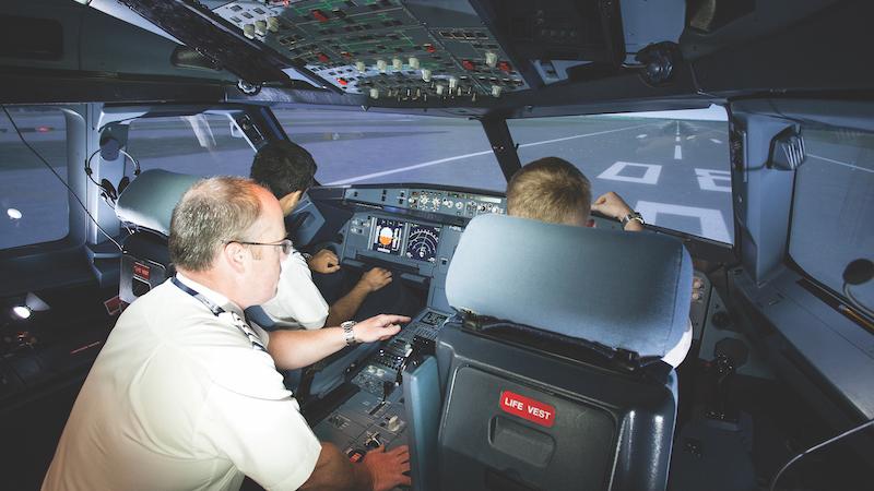 Pilots sitting in cockpit area
