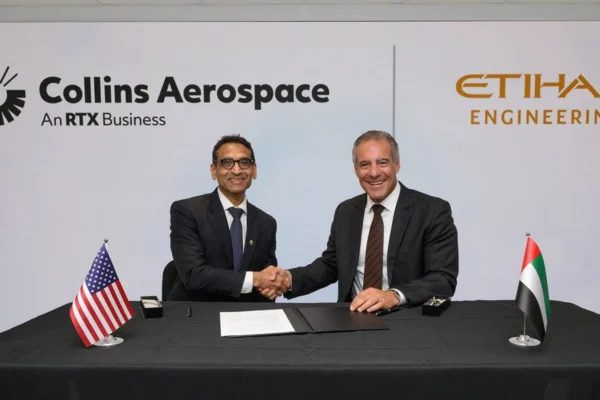 Collins Aerospace president of advanced structures Ajay Mahajan and Etihad Engineering chief executive Daniel Hoffmann sign the nacelle MRO joint venture.