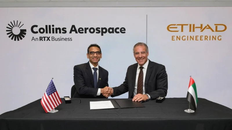 Collins Aerospace president of advanced structures Ajay Mahajan and Etihad Engineering chief executive Daniel Hoffmann sign the nacelle MRO joint venture.
