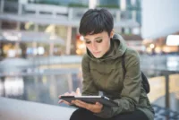 young woman using tablet
