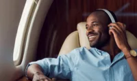 PrivateFly Jet Card_man seated_headphones