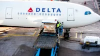Cargo loading on Delta aircraft. Credit: Sjors Evers/Wirestock / Adobe Stock
