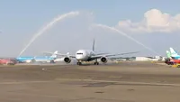 The inaugural Oman Air flight lands at Amsterdam Schiphol Airport.
