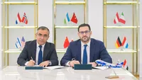 The signing between Silk Way West Airlines and Azerpost. Isi Mustafayev from Azerpost (left) and Vugar Mammadov from Silk Way West Airlines (right). Credit: Silk Way West Airlines