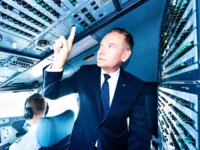 Jens Ritter, Lufthansa CEO switches on Starlink on the first revenue flight, August 19 2026 (Credit: Lufthansa Group)