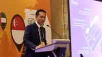 On stage at PAM APAC 2026. Shawn Lee, head of customer success management Asia, Skywise.