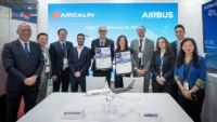 Eric Boucher, Vice President Maintenance & Engineering of Aircalin and Maud Rotereau, Vice President Commercial Services of Airbus (both in centre). Also in the photo is Raymond Lim, APAC Head of Services at Airbus (Left). Credit: Airbus.